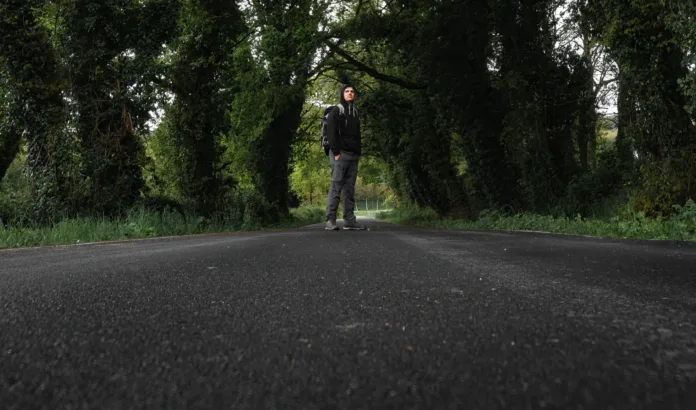 Young man walking in the forest